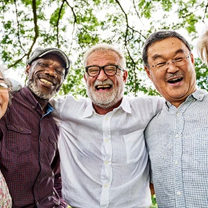 Dentures patient in Manchester smiling with friends