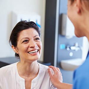 Dentures patient in Manchester smiling at dentist