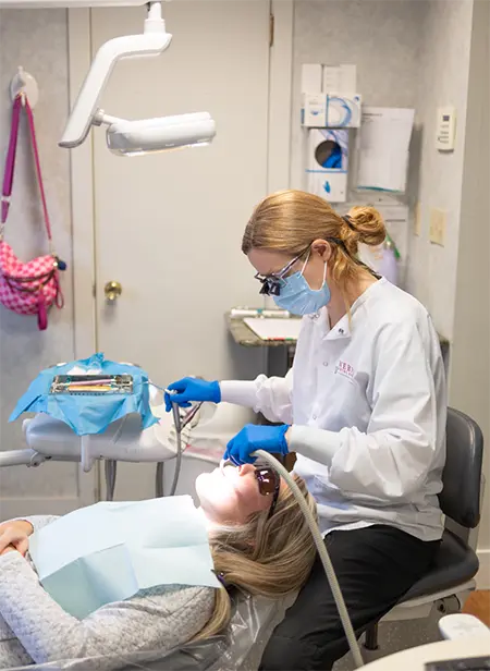 Woman receiving preventive dentistry checkup