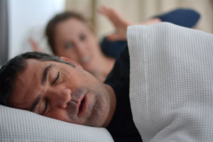 Woman frustrated with her husband’s sleep apnea snoring